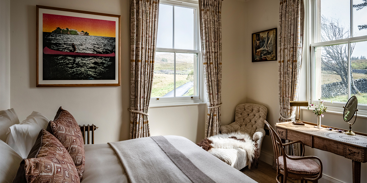 Bedroom interiors of luxury lodge at Scaliscro estate with sea views