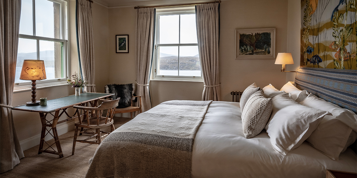 Bedroom interiors of luxury lodge at Scaliscro estate with sea views