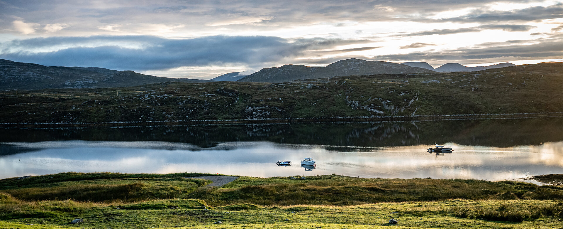 Panoramic view of SCALISCRO estate surrounded by loch and rugged Isle of Lewis landscape