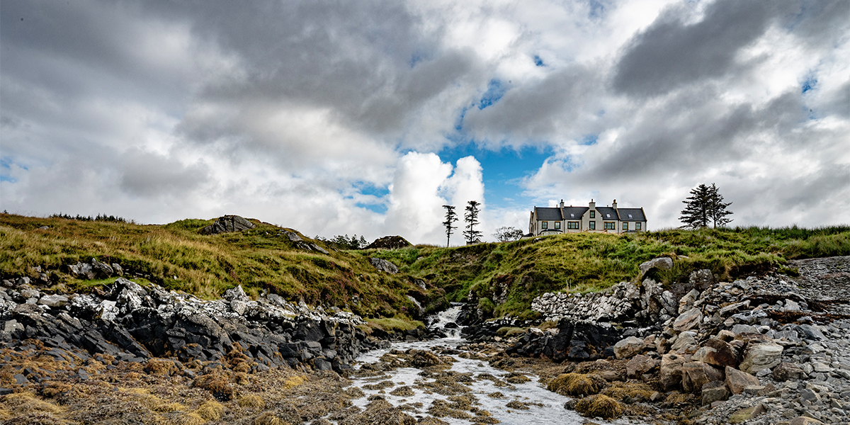Coastal view of SCALISCRO estate set within the wild Hebridean shoreline and landscape